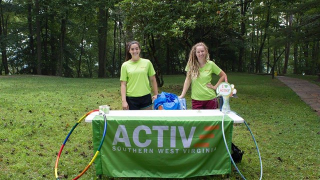Active Southern West Virginia park partners staffing table at a park event