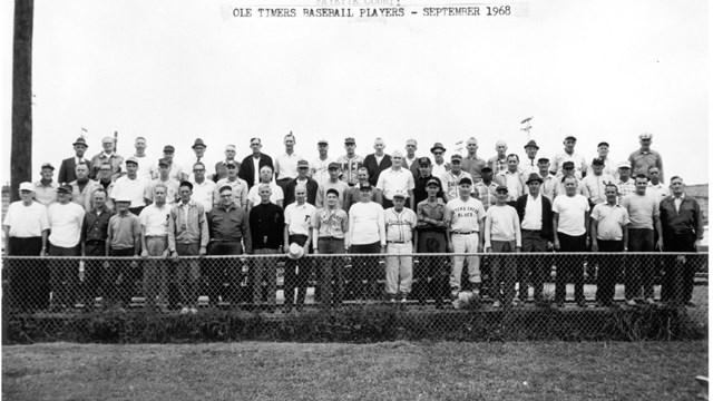 Black and white photo of a group of older baseball players