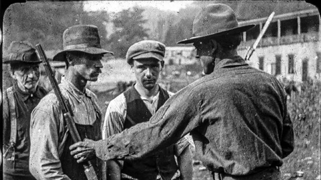 historic photo of miners with guns