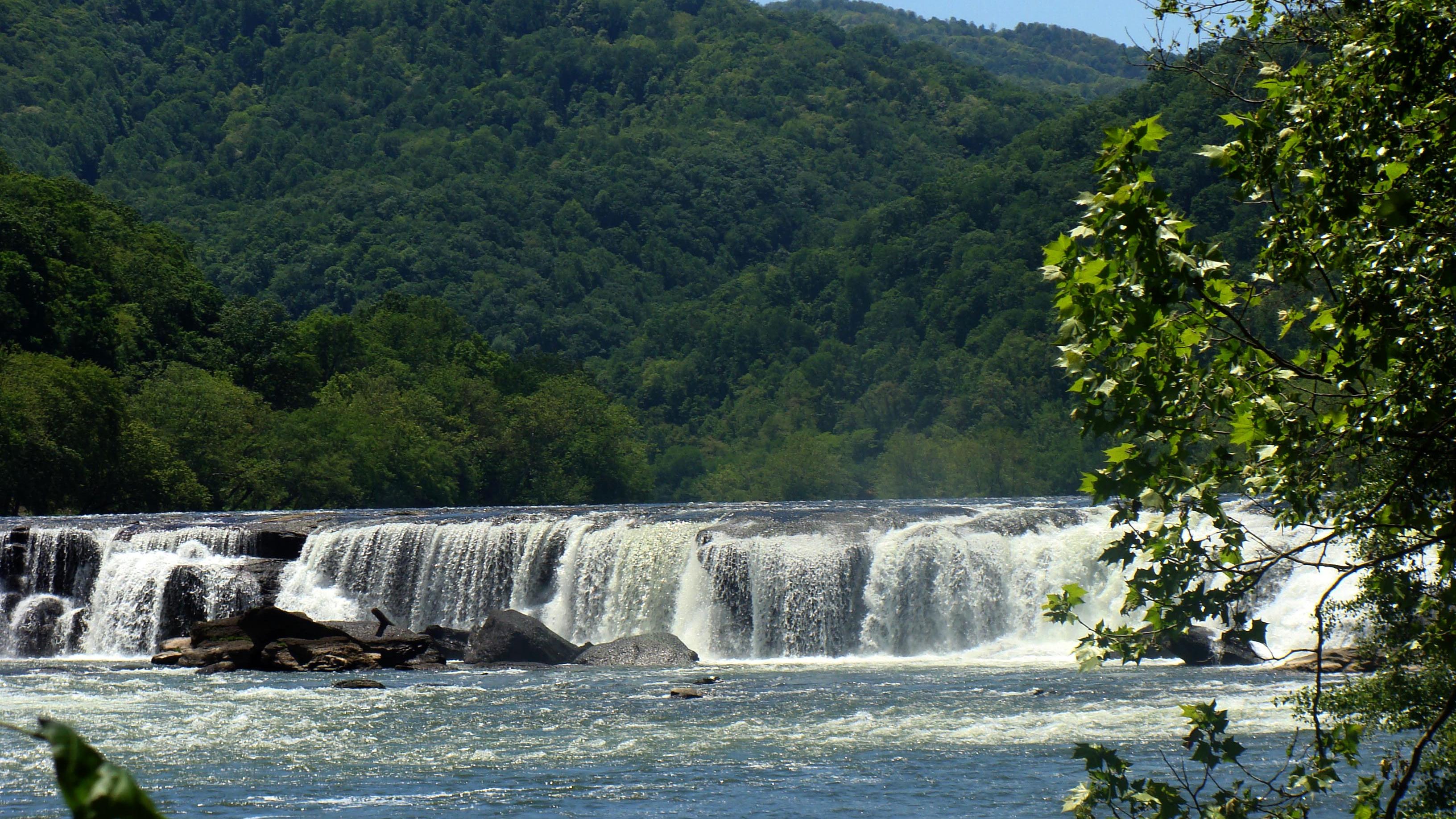 waterfall spanning across a river