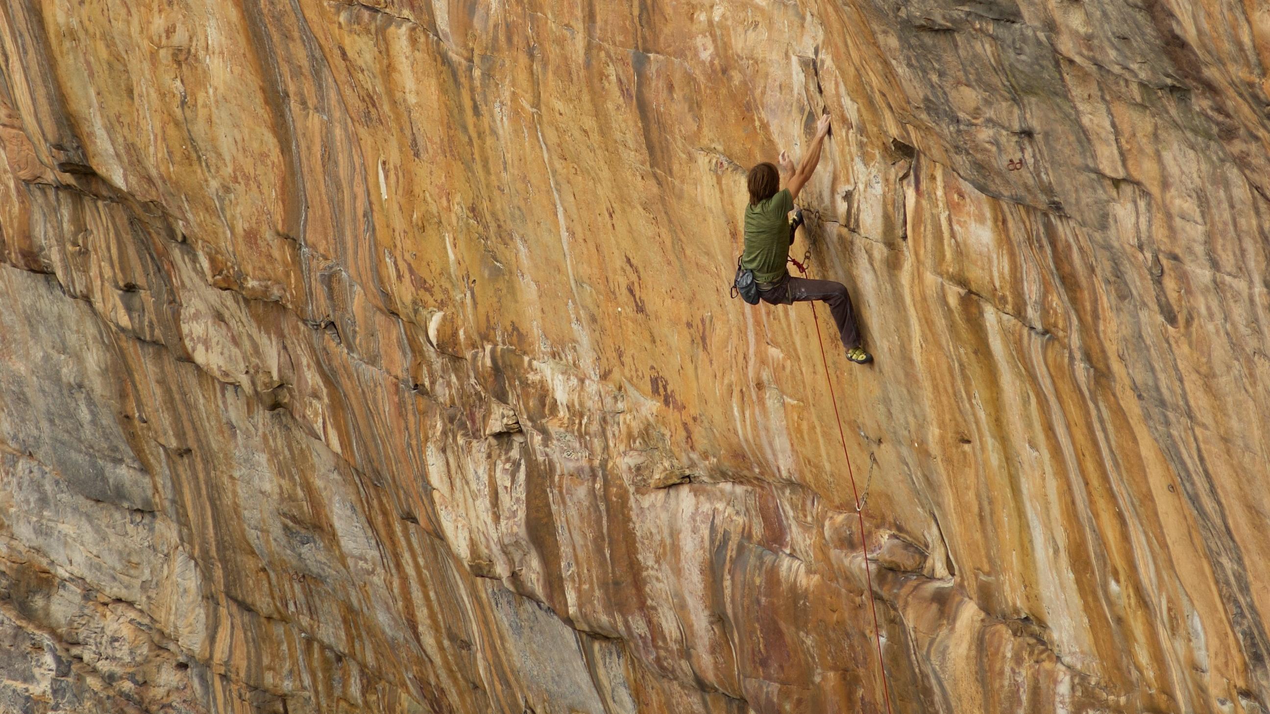 rock climber scaling a cliff
