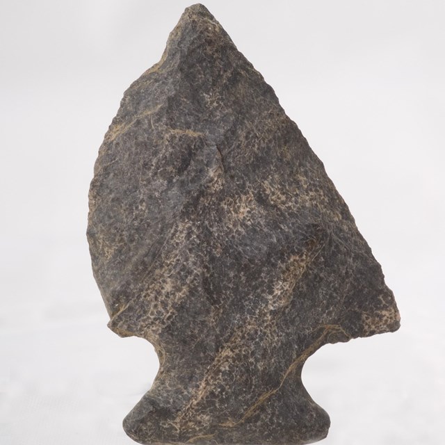 A grey stone arrowhead