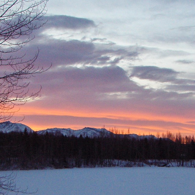 Sunset over a snow covered lake in Southcentral Alaska