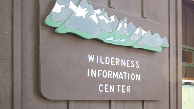 a sign outside a ranger station 