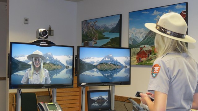 Ranger in front of a webcam also displaying on two monitors