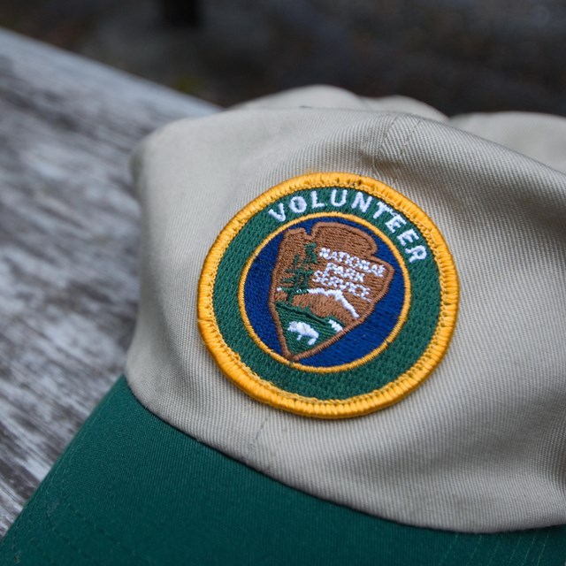 Baseball cap with an NPS Volunteer logo patch