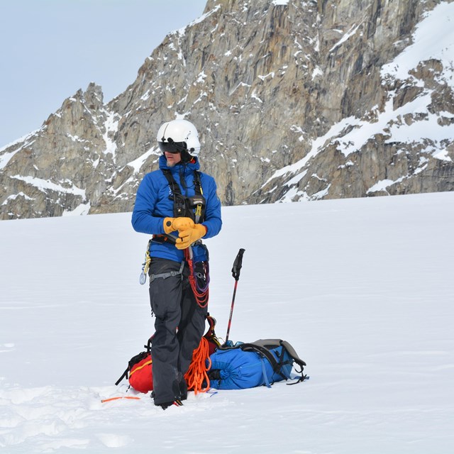 Mountaineer beginning to set up basecamp gear