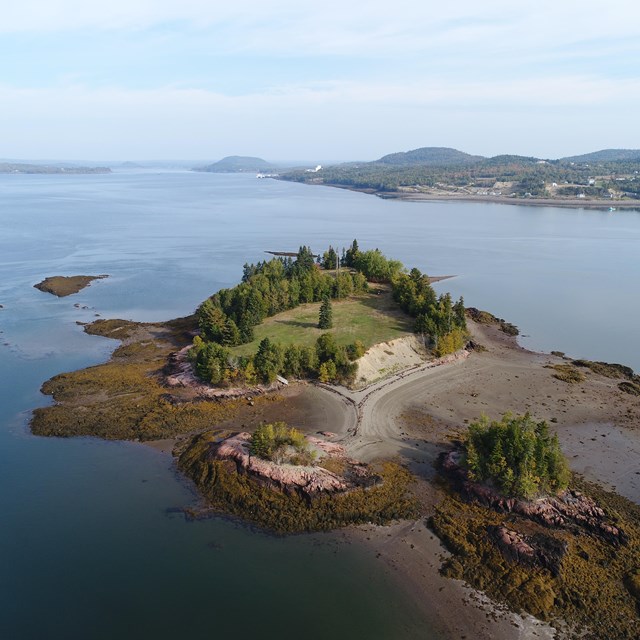 Aerial view of an island with remnants of a settlement