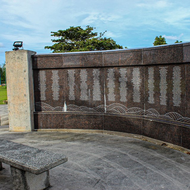 An memorial wall with a list of names 