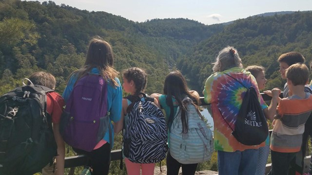 A group of kids at Lilly Bluff overlook.