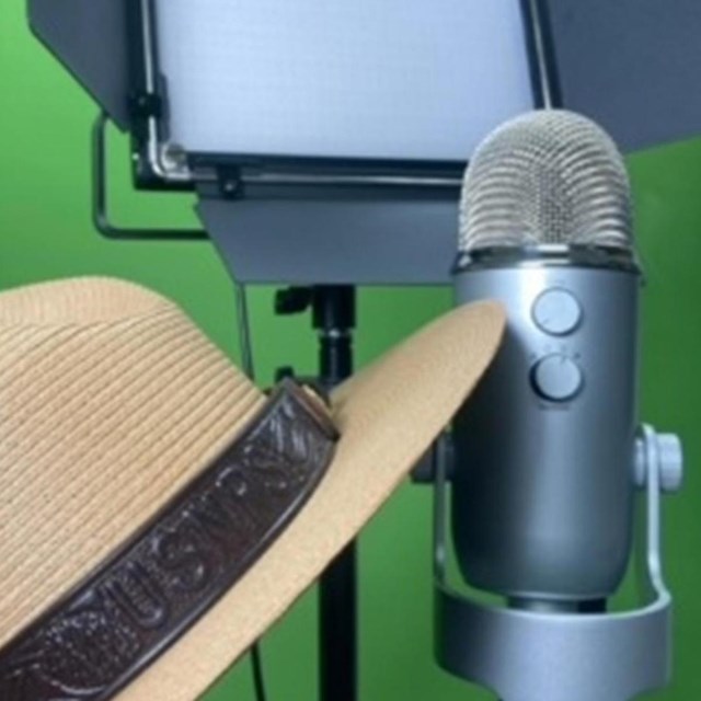 A NPS ranger hat, microphone, and a studio light. 