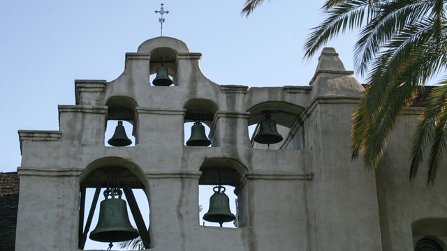 A weathered bell tower of a Spanish-colonial mission. 