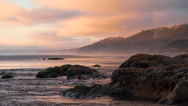 Scenic coastal beach at sunset.