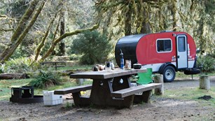 Red trailer set up in the Hoh campground.
