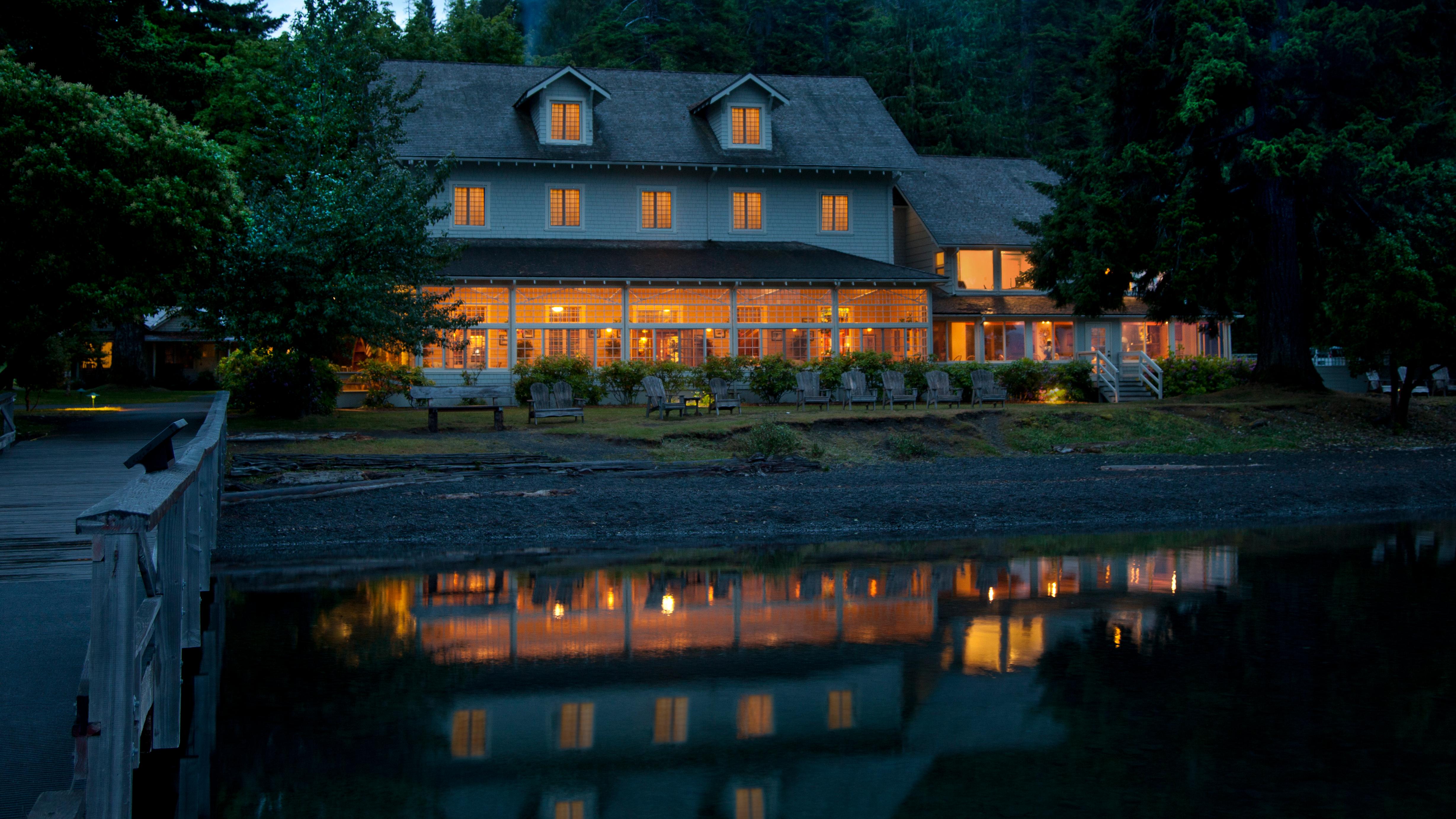 Lake Crescent Lodge glows upon an evening lake.