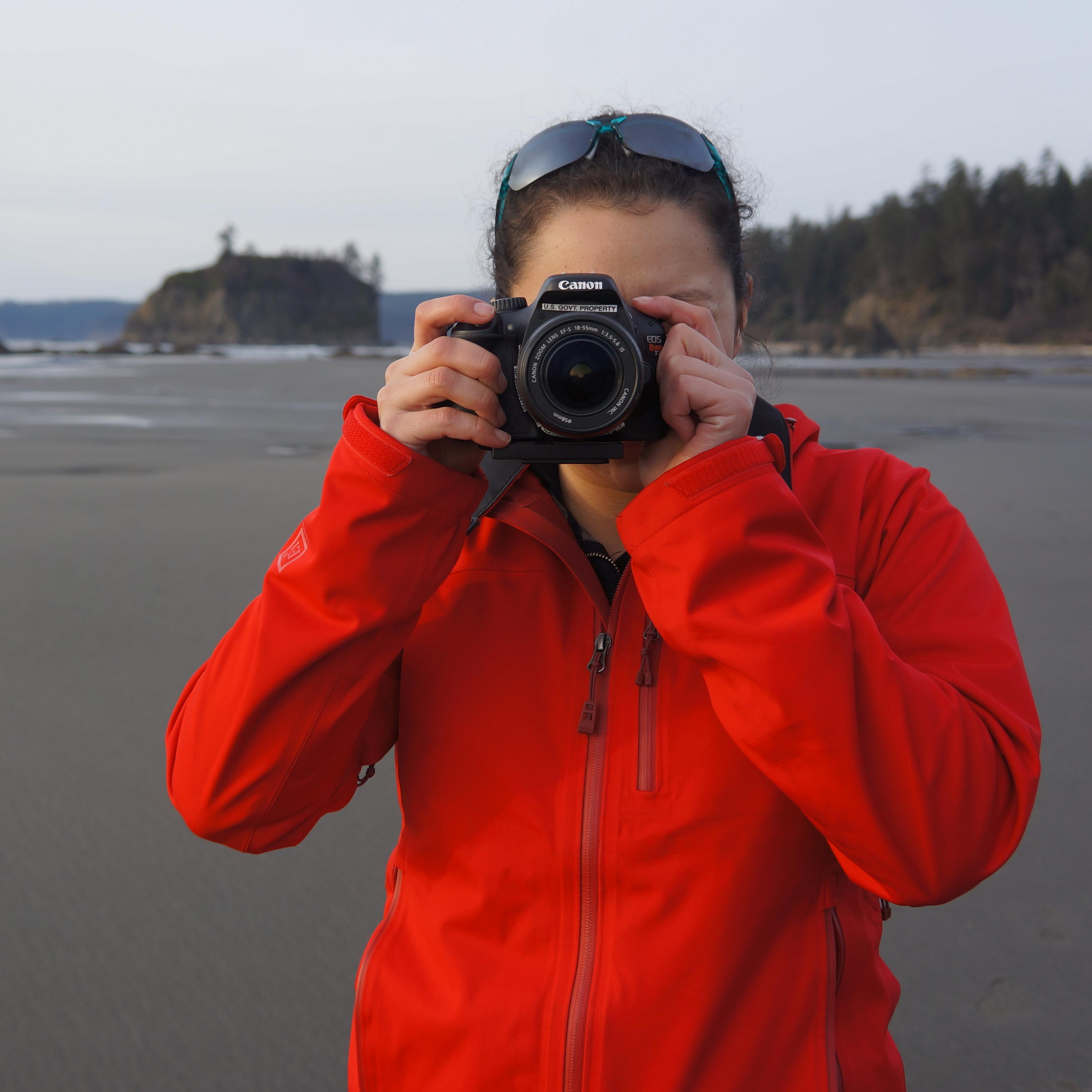 Photographer taking a photo at the beach.