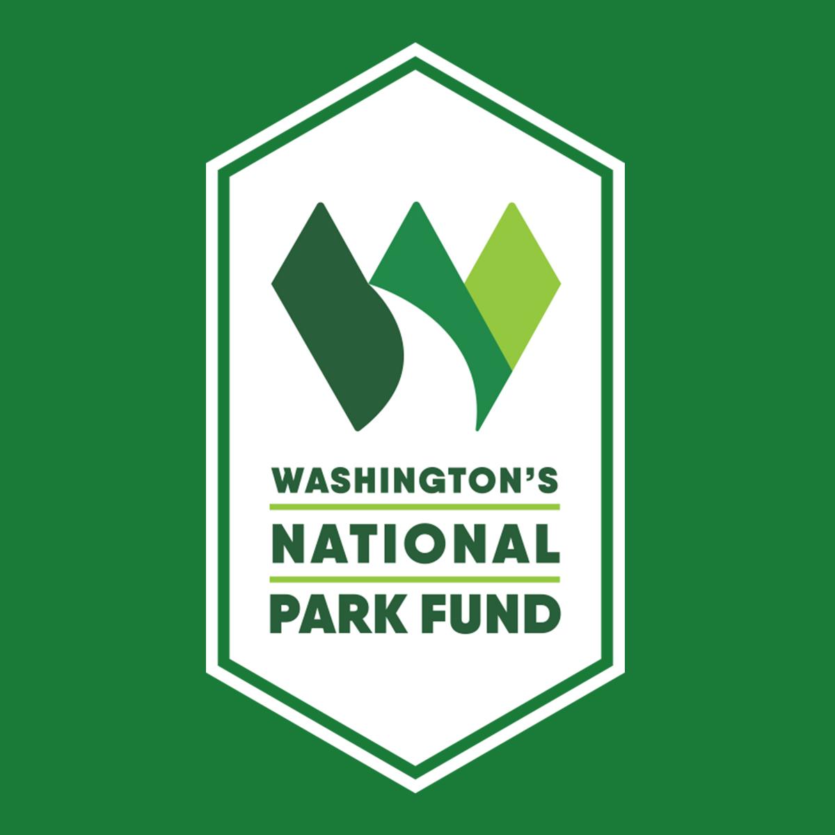 a logo in a shape of the letter W evoking the shape of mountains and a river 