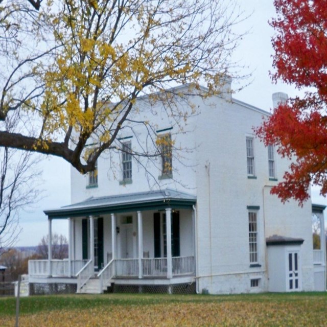 A white two story farmhouse