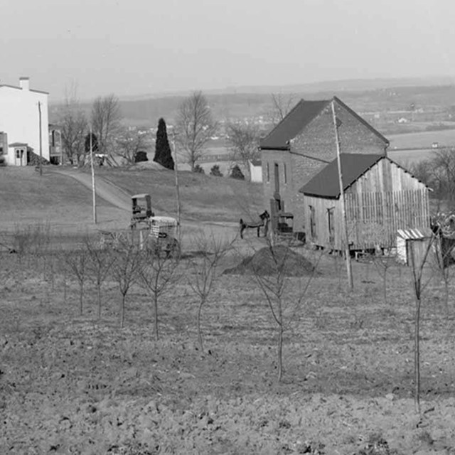 A black and white image of a farm