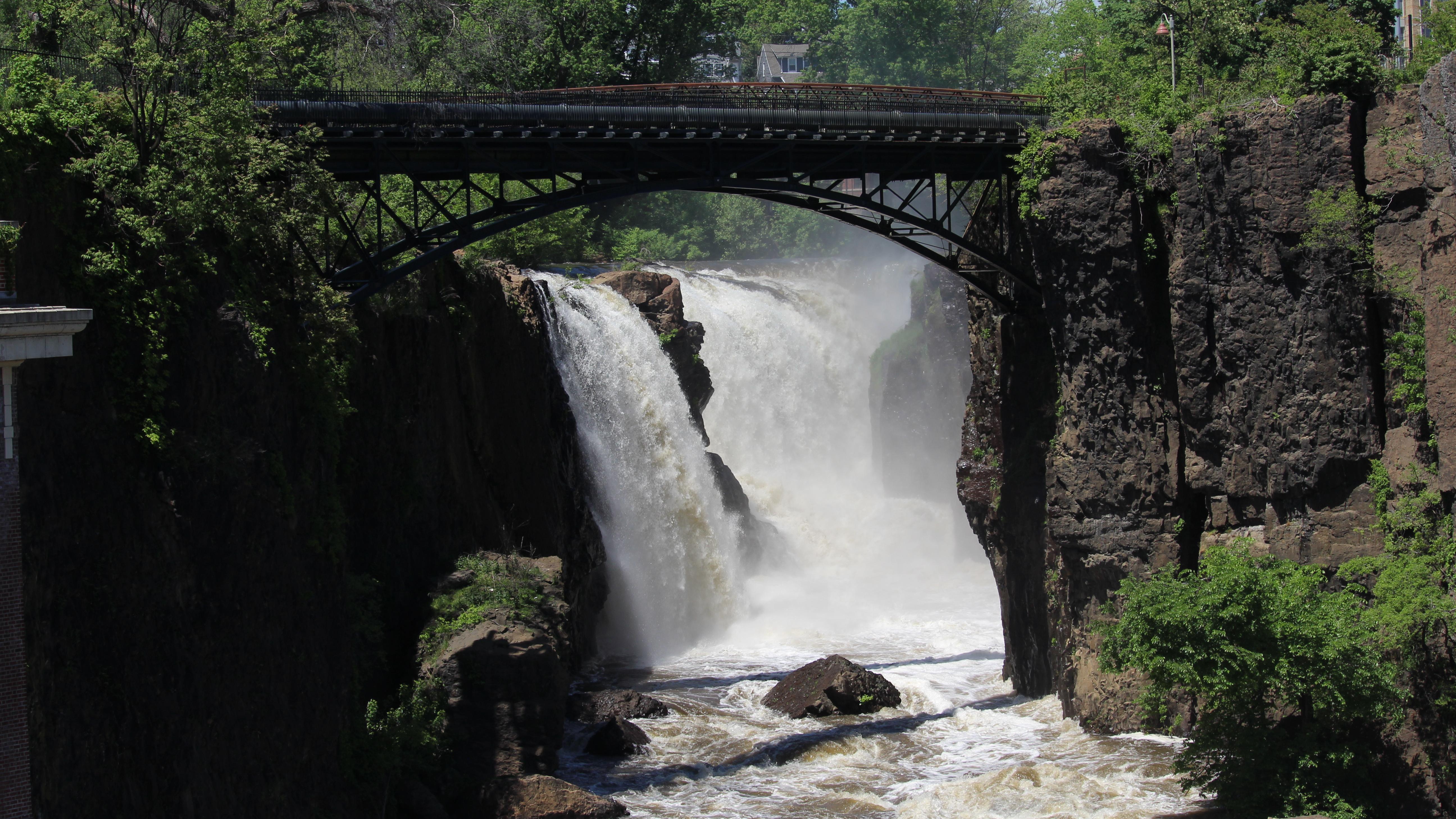 A pipe bridge over the waterfall