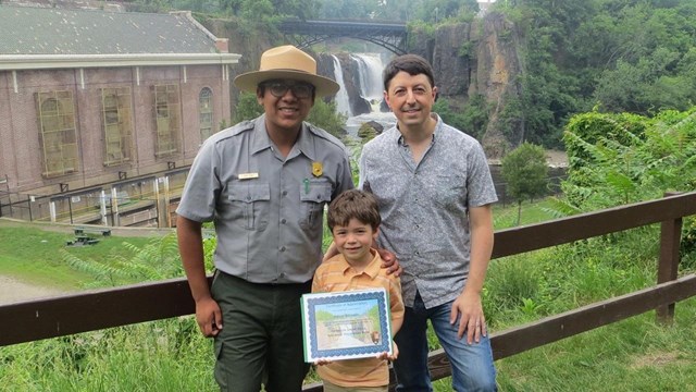Picture of a Ranger swearing in a Junior Ranger. 