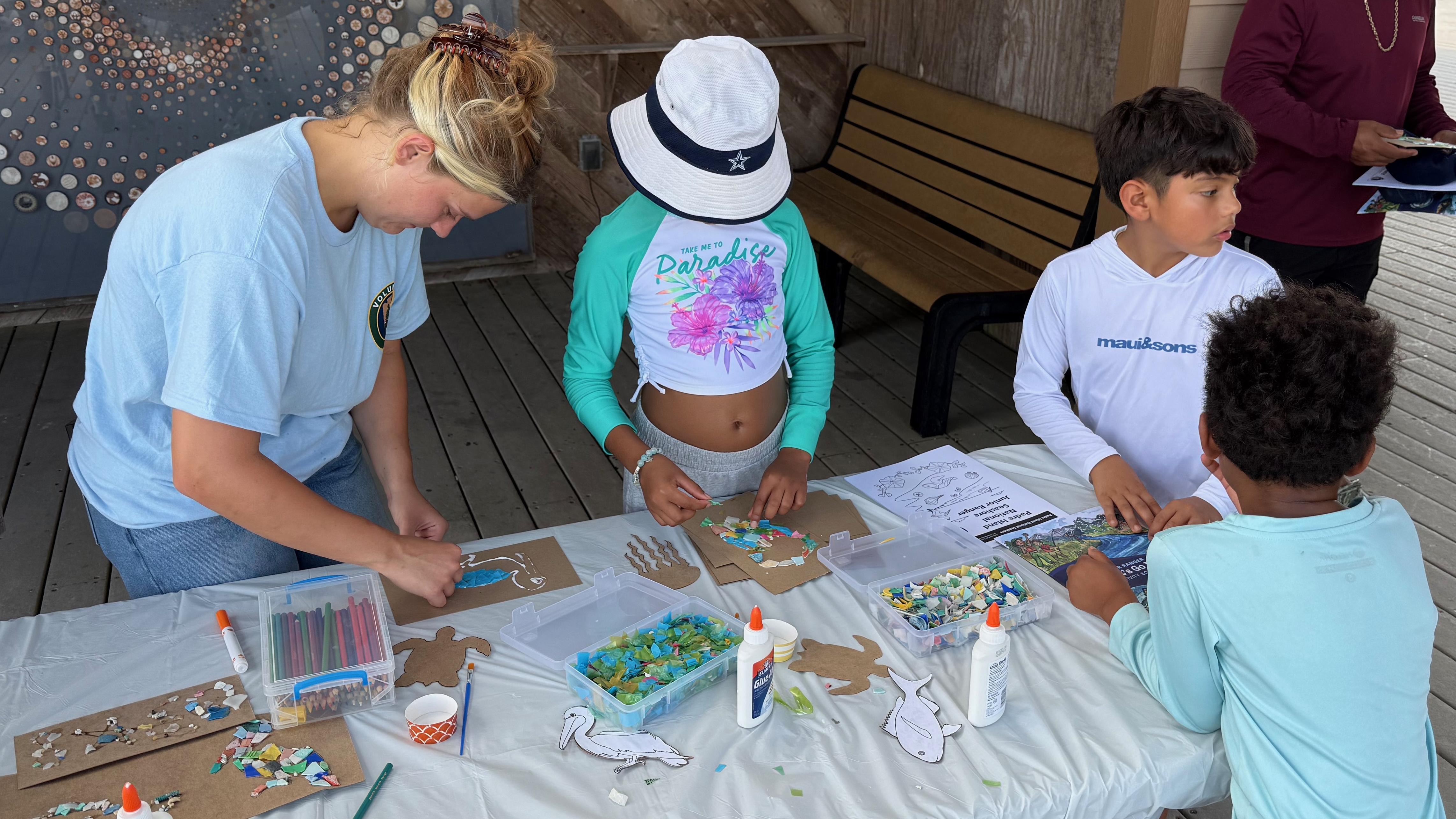 Several kids participating in an art activity. 