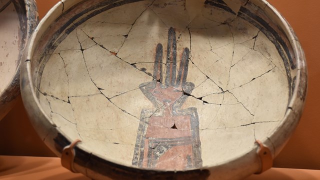 Bowl with orange and black figure in bottom