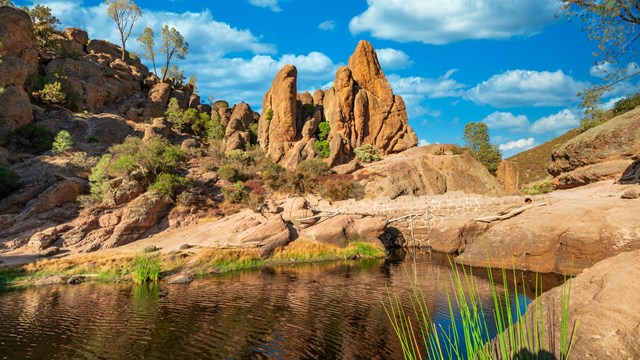 A scenic image of rock formation and water. 