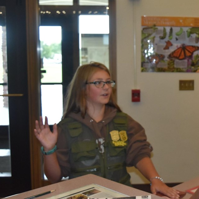 A woman swearing in a child as a Junior Ranger