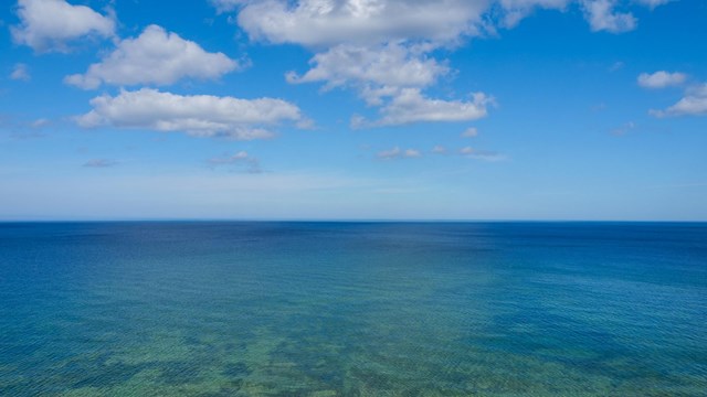 Lake Superior's blue-green waters stretch as far as the eye can see
