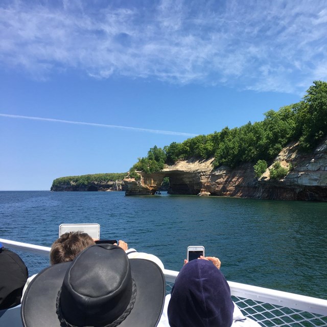 Visitors on the Pictured Rocks boat cruise enjoying the view.