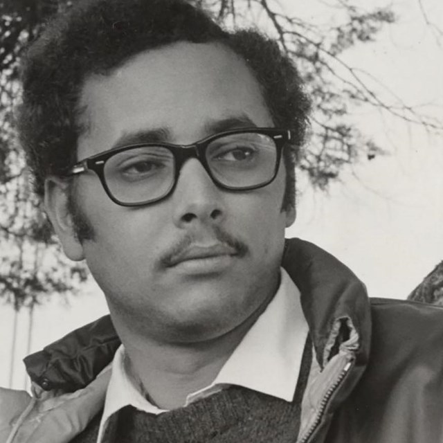 Young African American man with large glasses