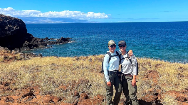 Pair of interns on seaside trail