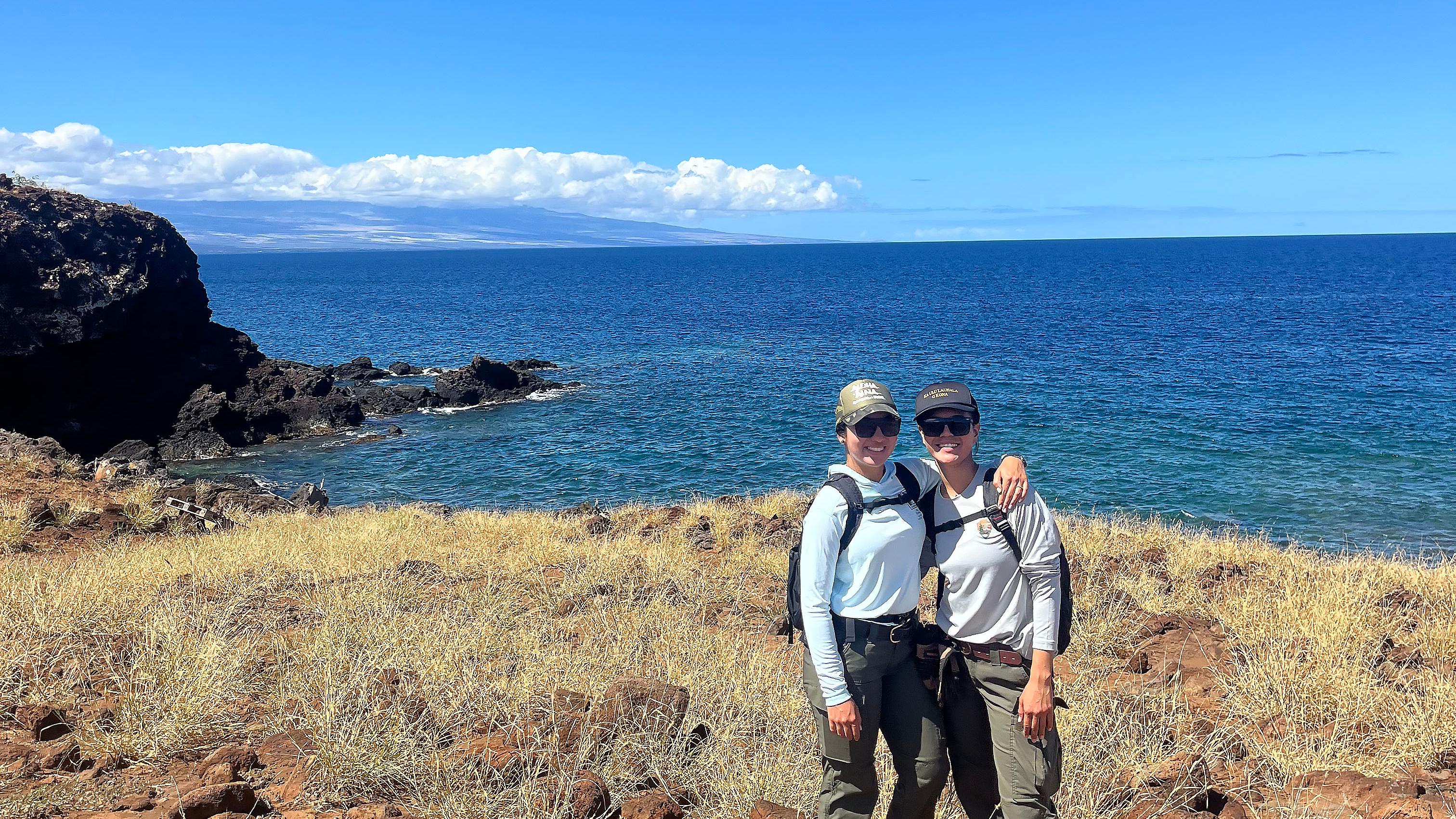 Pair of interns on seaside trail