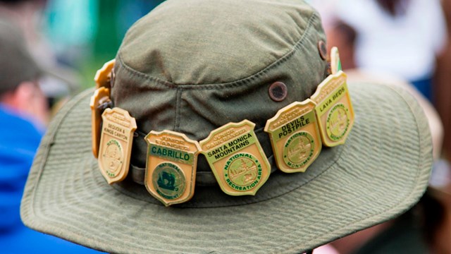 A Junior Ranger showcases his badges from across the country. NPS/Rachel Hendrix