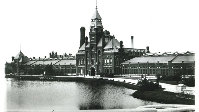 Classic view of the Administration Building with "Pullman" on the banks of Lake Vista. 