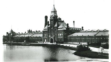 Classic view of the Administration Building with "Pullman" on the banks of Lake Vista. 