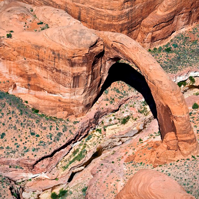 Aerial view of Rainbow Bridge National Monument. Dramatic rock structures.