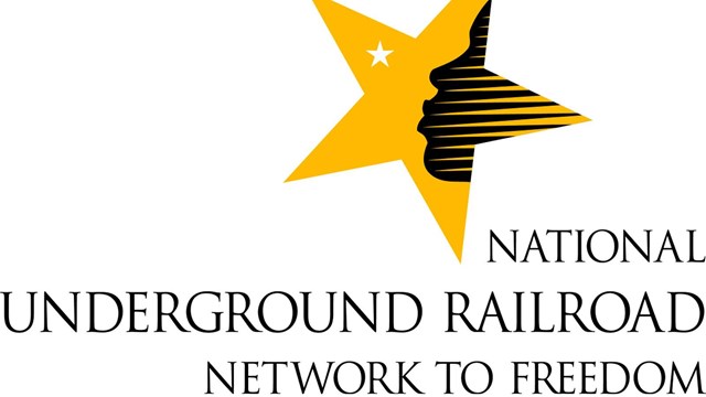 A star with a face blowing a smaller star, "National Underground Railroad Network to Freedom."