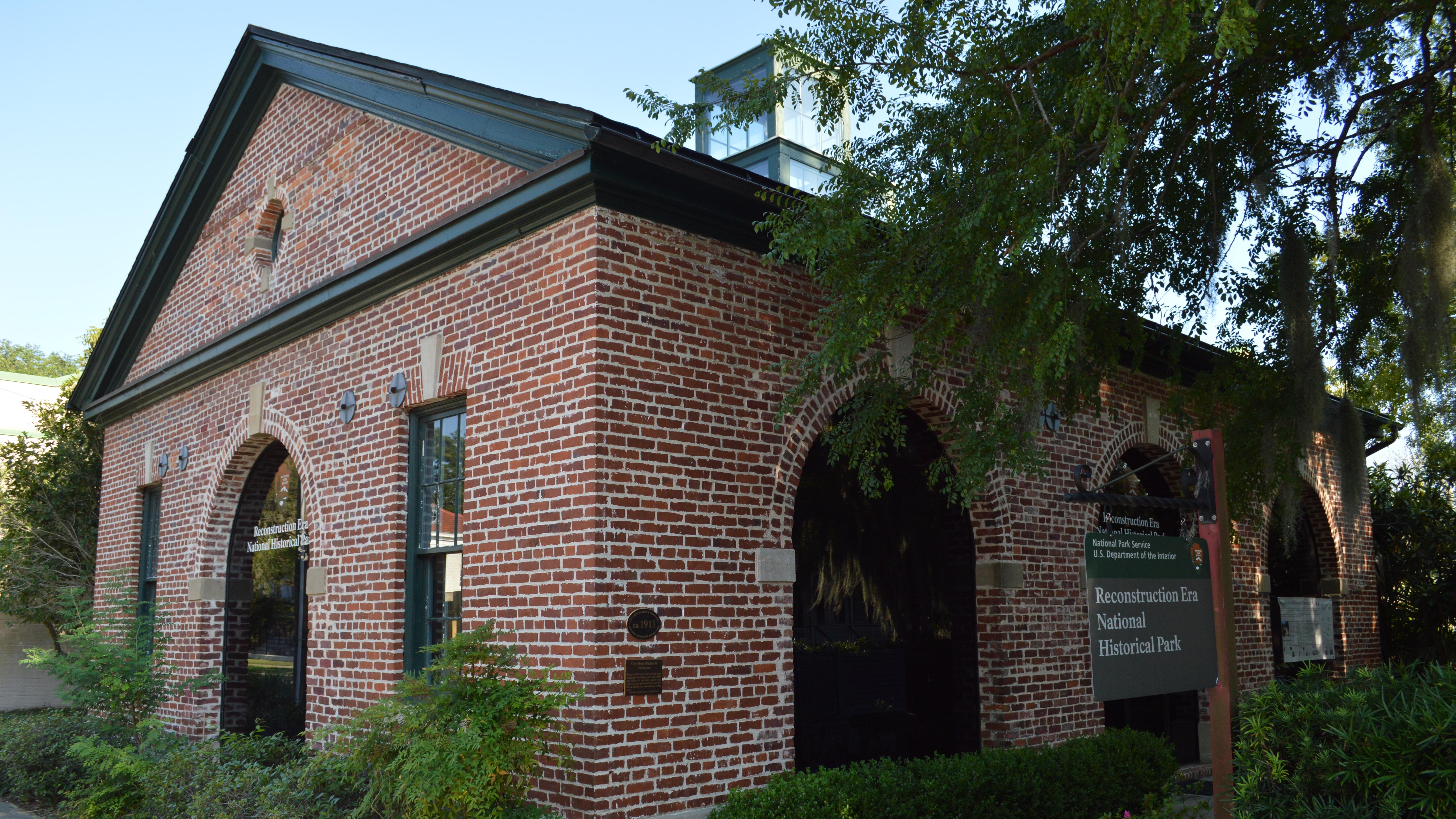 A single-story brick building with arched windows.