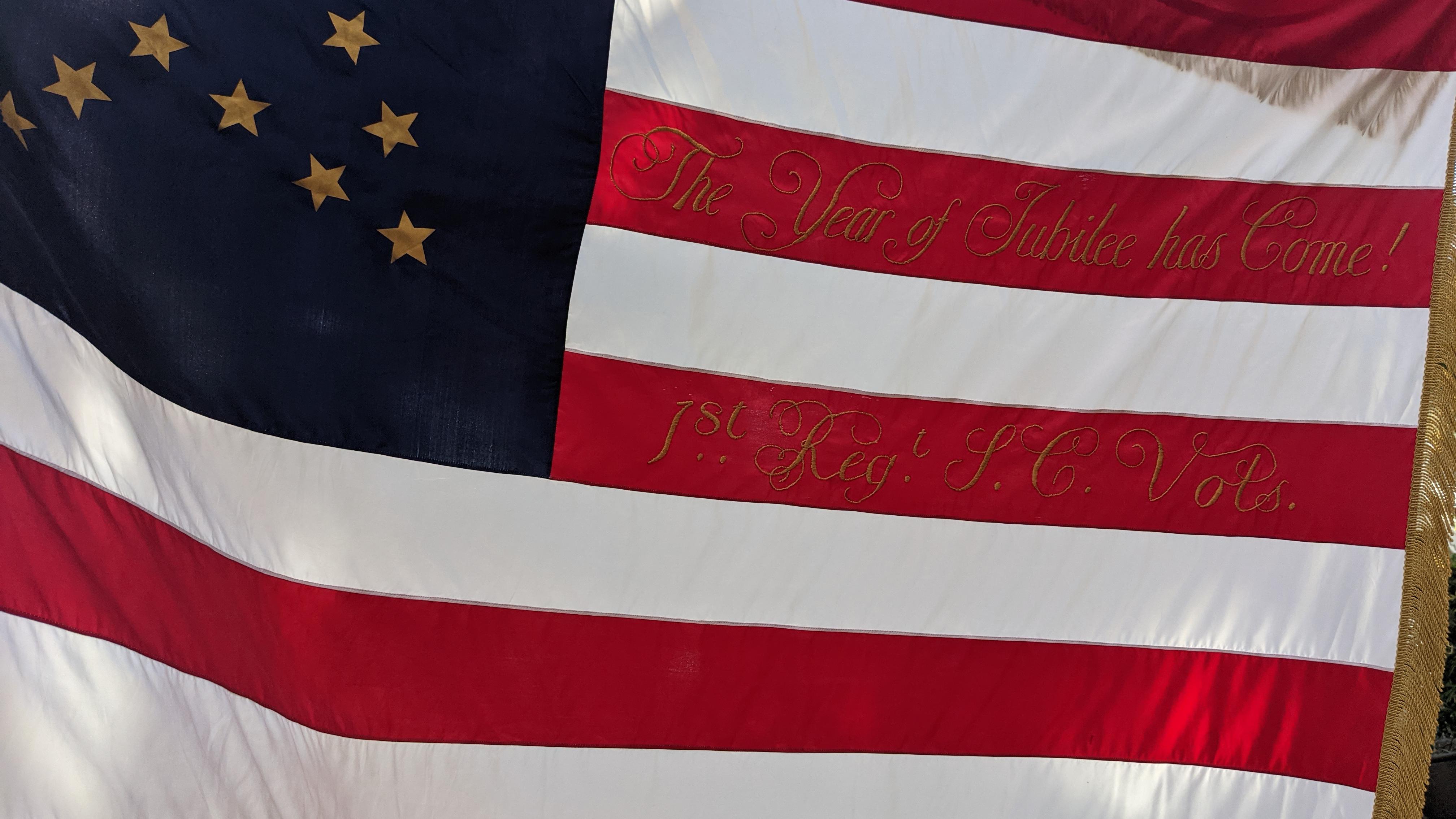 An American Flag with "The Year of Jubilee" stitched into the stripes.