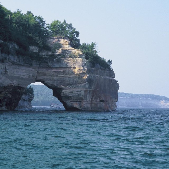 Little Portal Point along the Pictured Rocks, as viewed heading west on a hazy day.