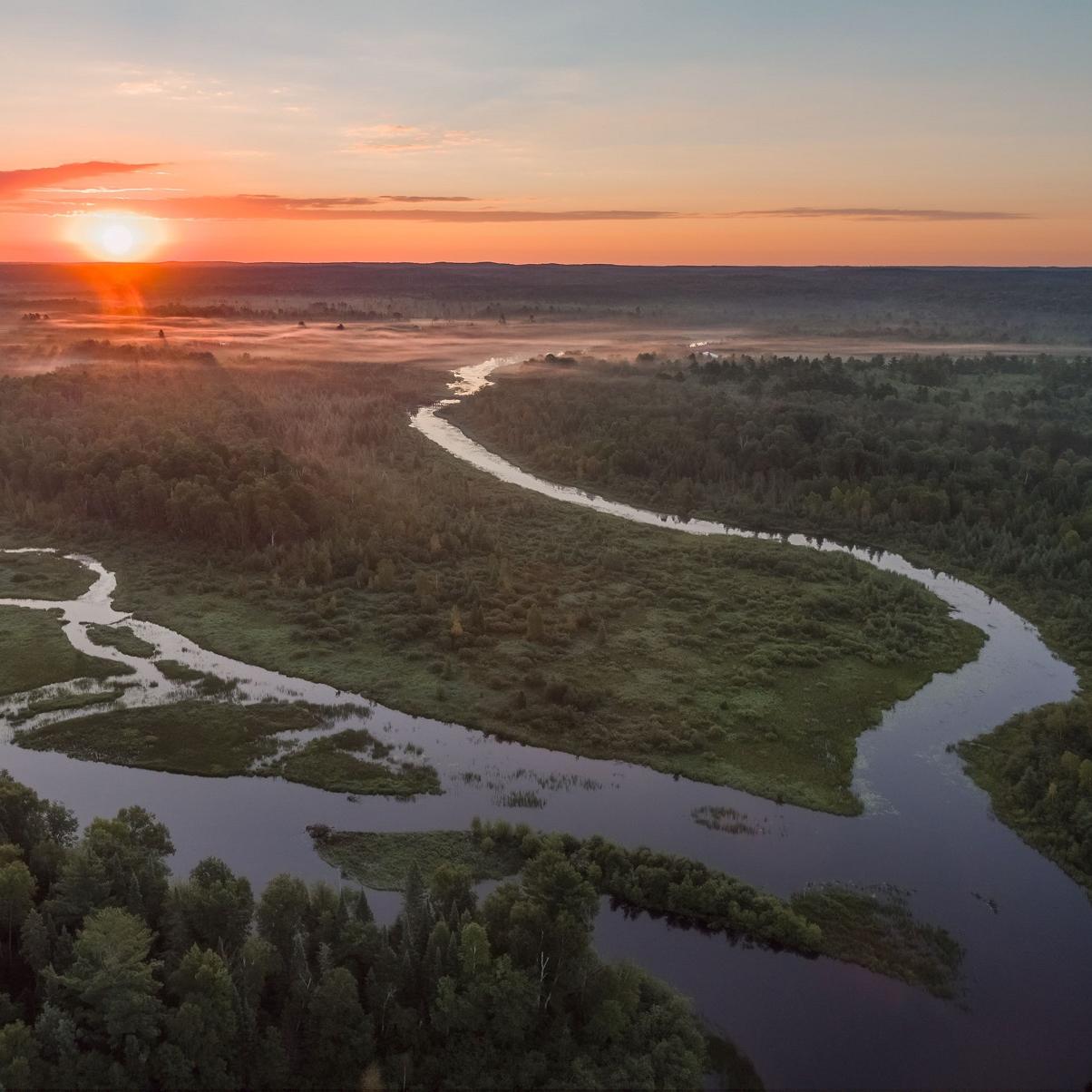 Braided stream flowing across the landscape at sunset. Credit: Craig Blacklock