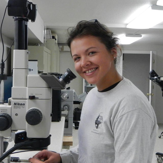 Intern at microscope