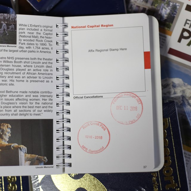 An image of a small National Park Service passport book, open to the National Capital Region page. 