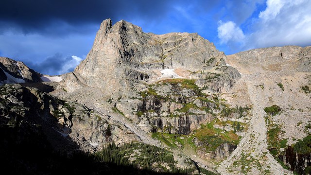 Dark clouds roll in over Notchtop Mountain ahead of a storm in early fall