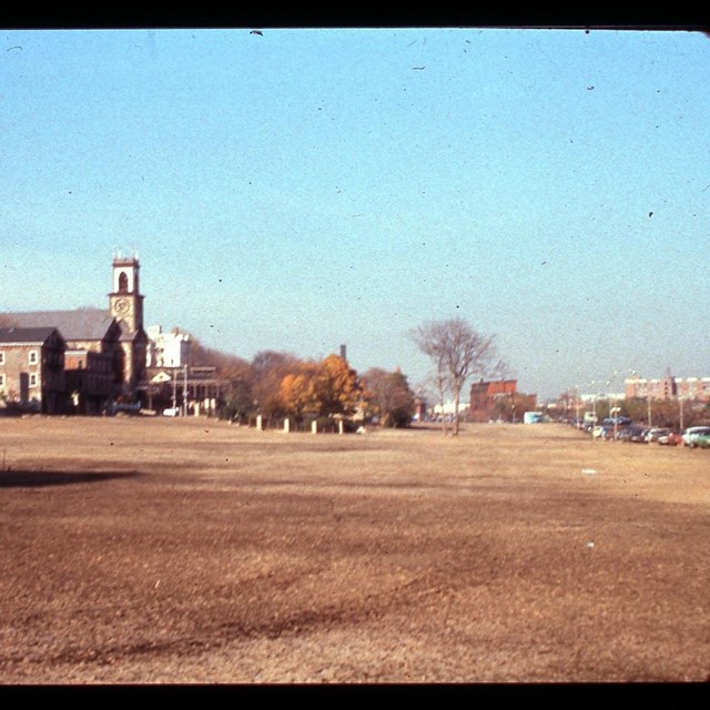 An old color photograph of an open landscape in downtown Providence