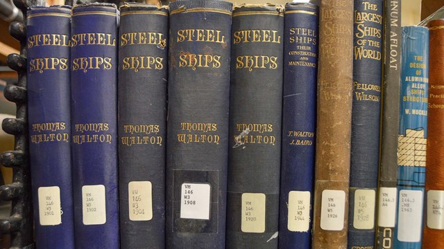 a row of library books on a shelf