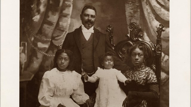 historic photo from 1886 of a wealthy black family posed for a portrait