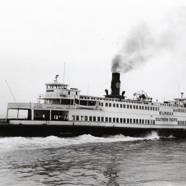 Black and white photo of steam paddle ferry Eureka on the water in 1957